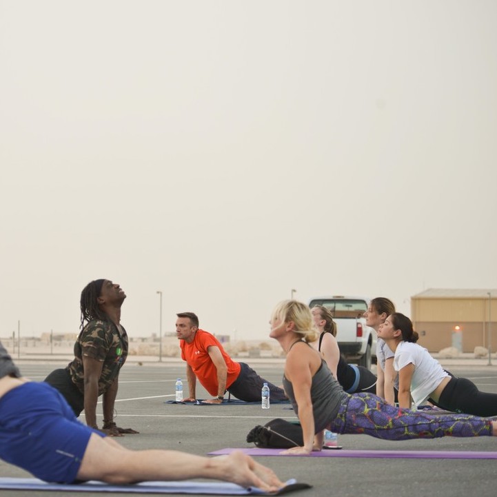 people doing yoga snake pose